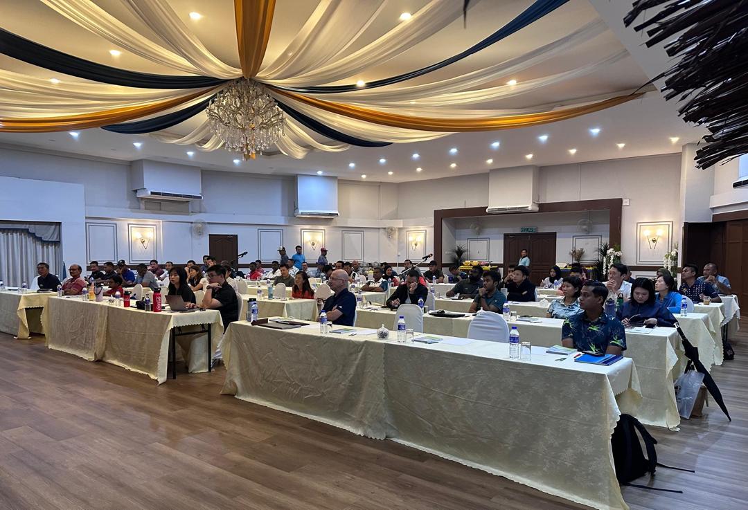 Hands holding event materials